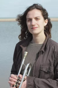 portrait of Emily Kuhn with trumpet