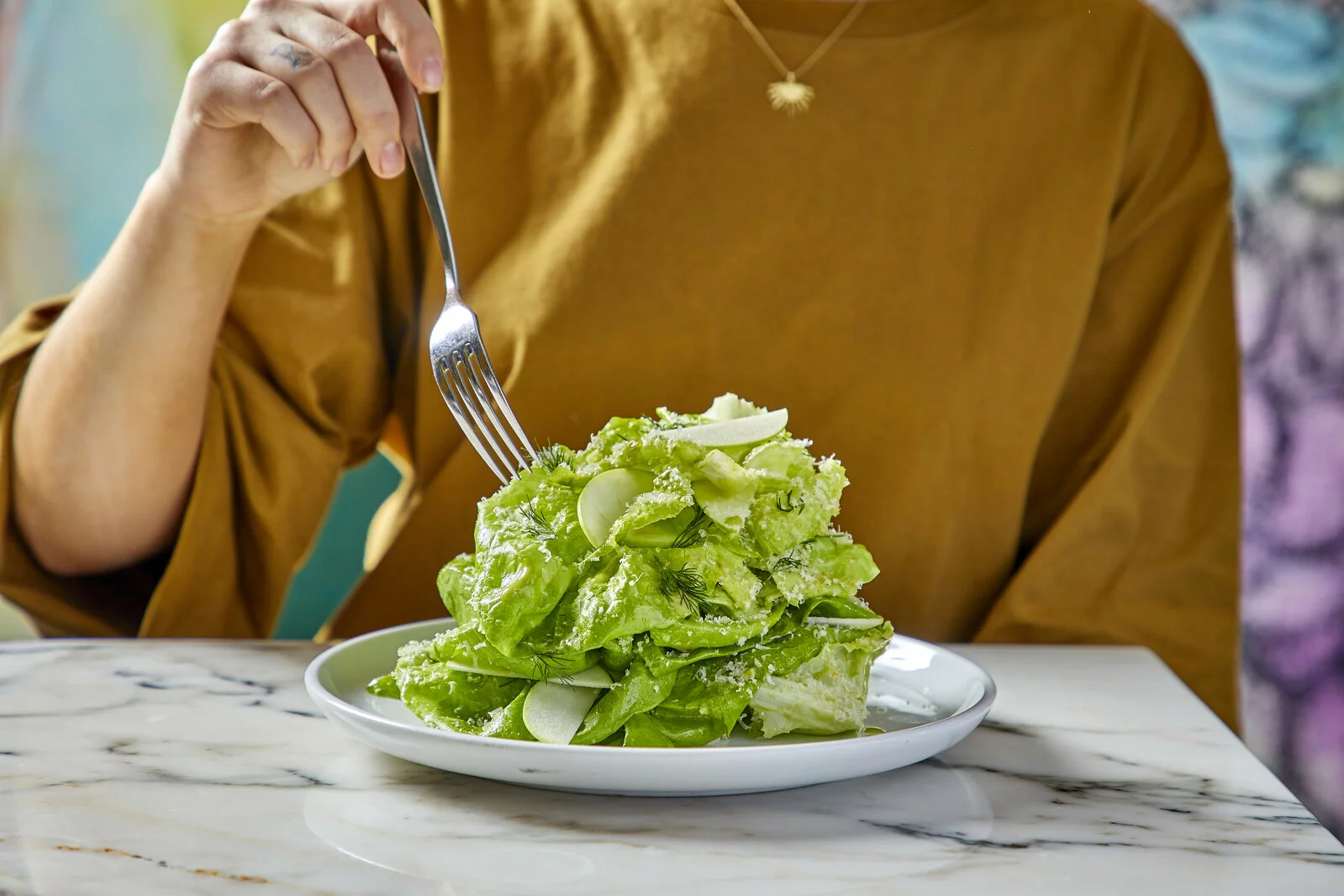 The Marisol salad: butter lettuce, apple, dill, macadamia nut, pecorino, and “natural food salad dressing” from the MoMA Artist’s Cookbook. Photo: John Neil Burger. 2022/09/Marisol_112219_012.jpg 