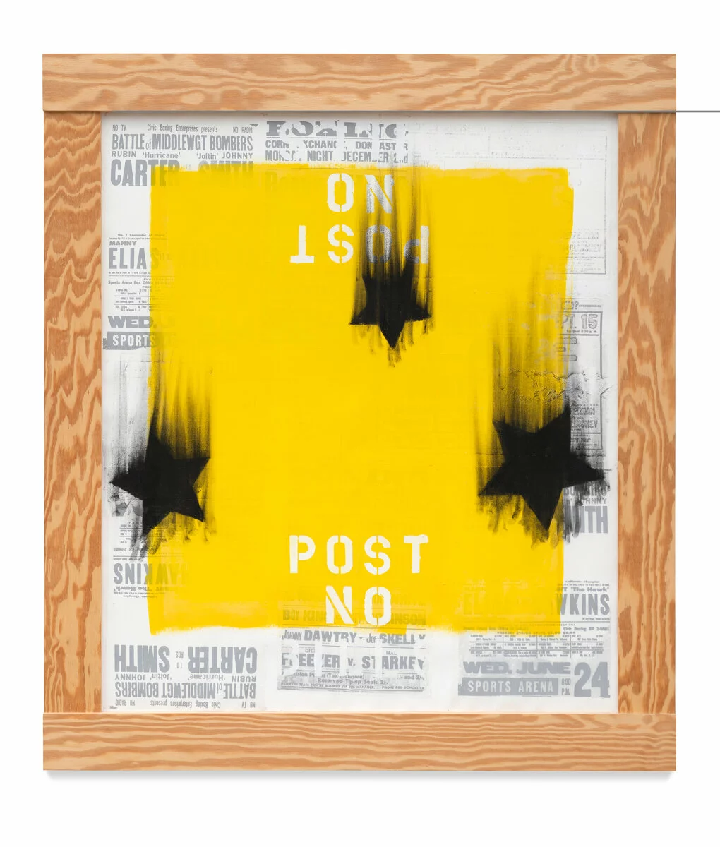 An artwork featuring a yellow square painted over printed black-and-white advertisements. On the top and bottom of the square is white text reading Post No; the top text is upside down. Over the entire artwork are three black stars that seem as if they are falling based on the streaks.