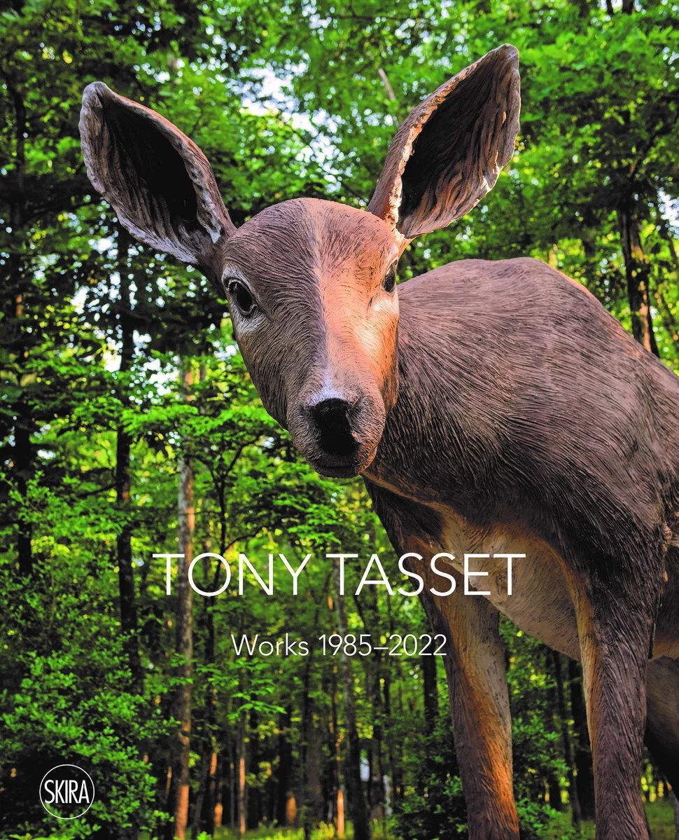 Cover image of a Tony Tasset book featuring an image of a plastic deer in a wooded area.