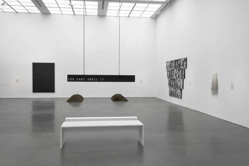 White-walled gallery space with several works on view.