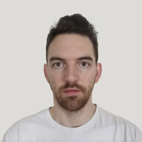 Portrait of a light-skinned man with short dark hair wearing a white t-shirt against a white background. He doesn't smile making it look like a passport photo.