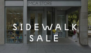 The MCA Store from the exterior with the words Sidewalk Sale