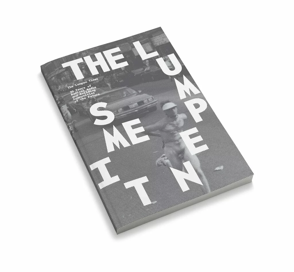 Grey book cover with white text spelling out The Lumpen Times in a clockwise fashion.
