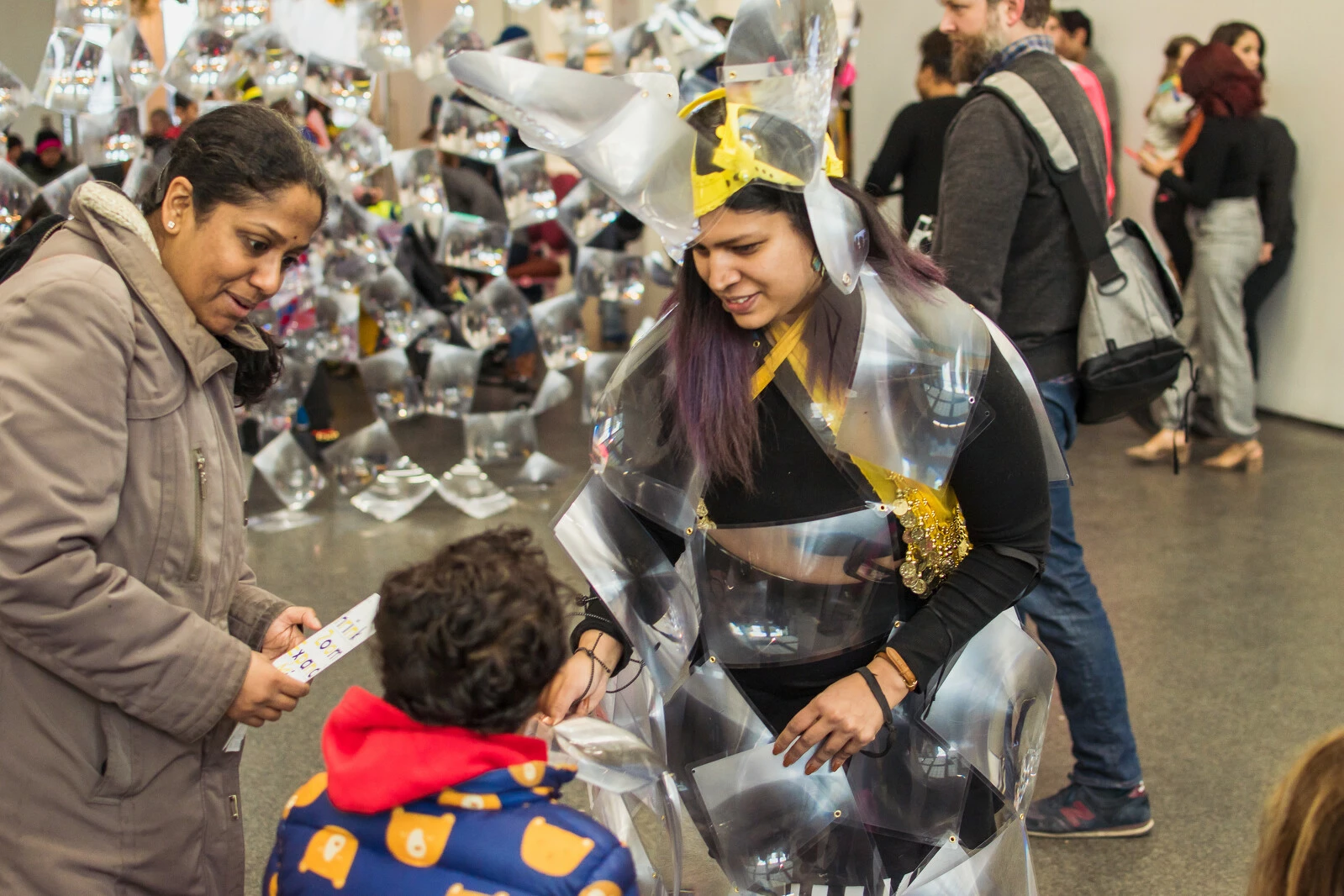 Kids and adults wearing abstract costumes