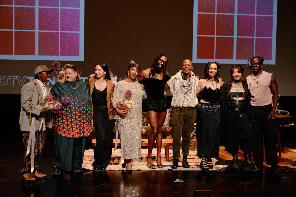 A group of people lined up on a stage