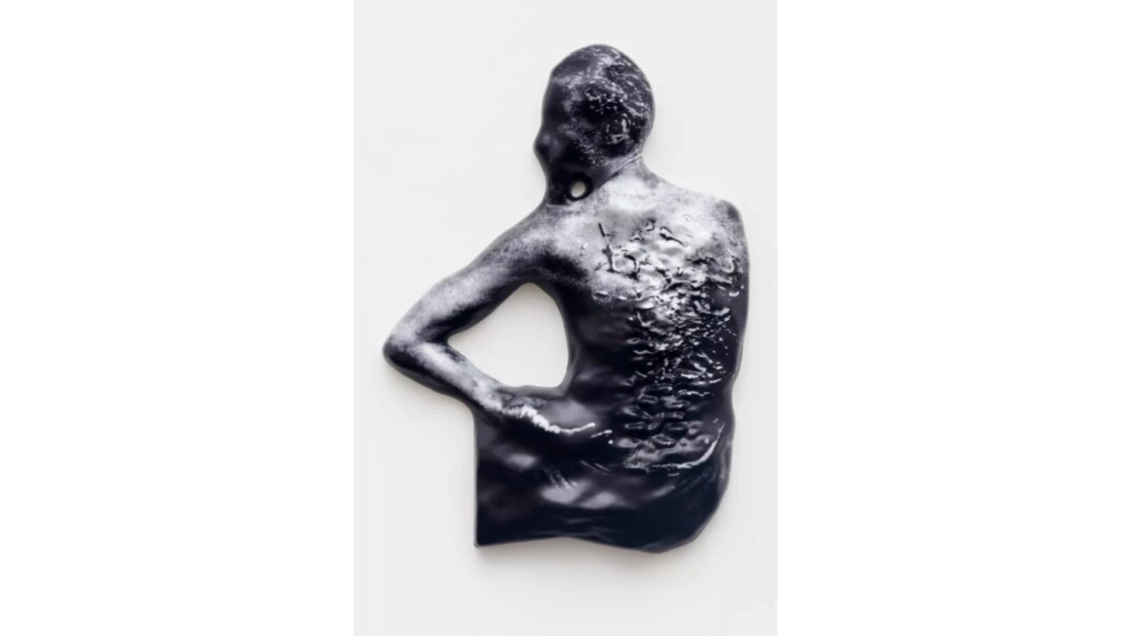 An image of a person with their face blurred and many scars on their back cropped from their contextual surroundings and placed against a white background