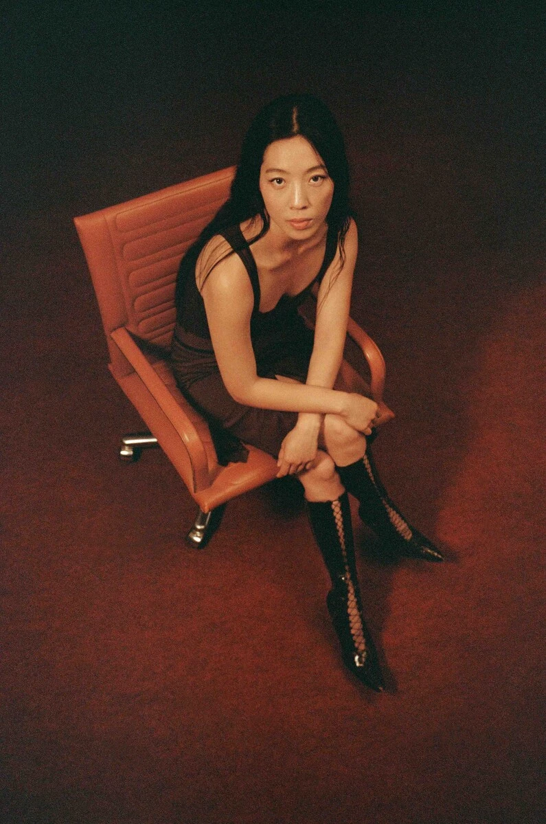 Portrait of a person sitting in a leather board room chair as viewed from above